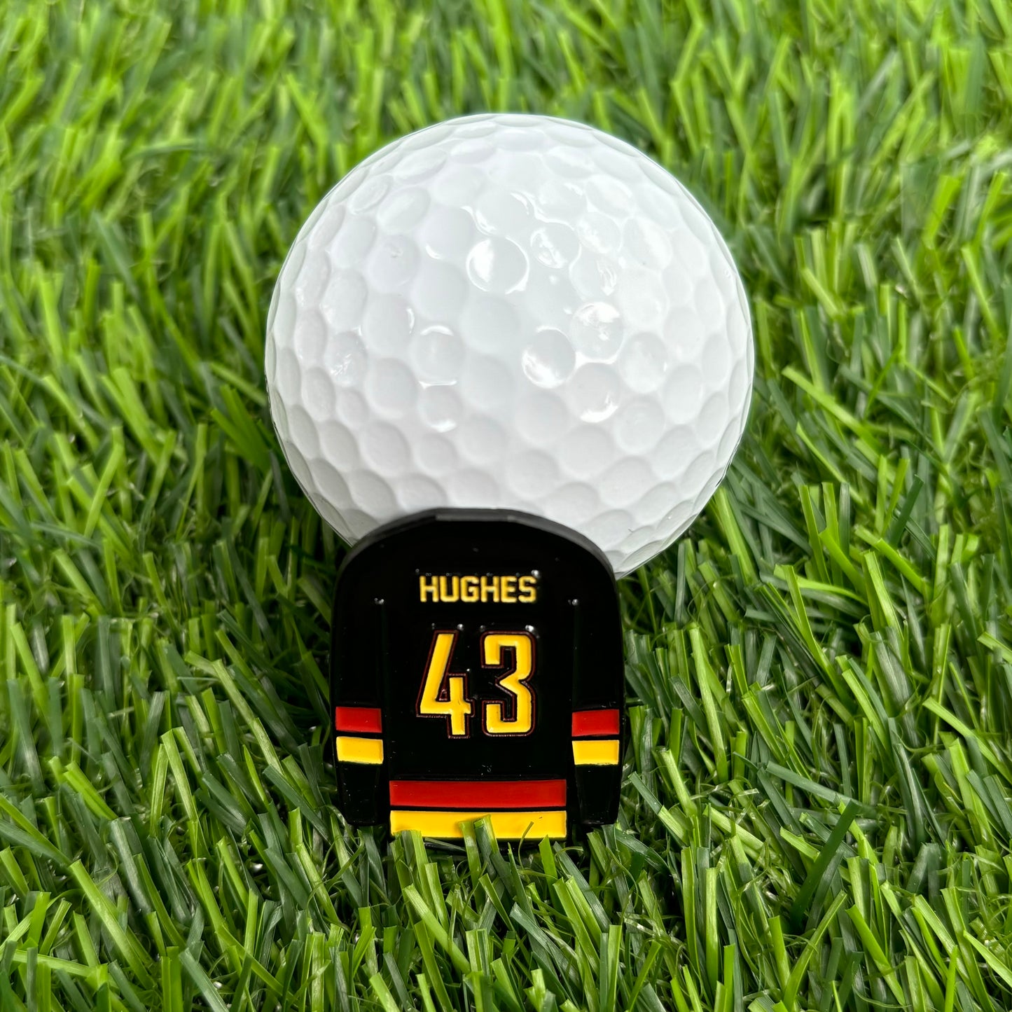 Quinn Hughes customizable golf ball marker with number 43, perfect for golf enthusiasts and Vancouver Canucks fans.