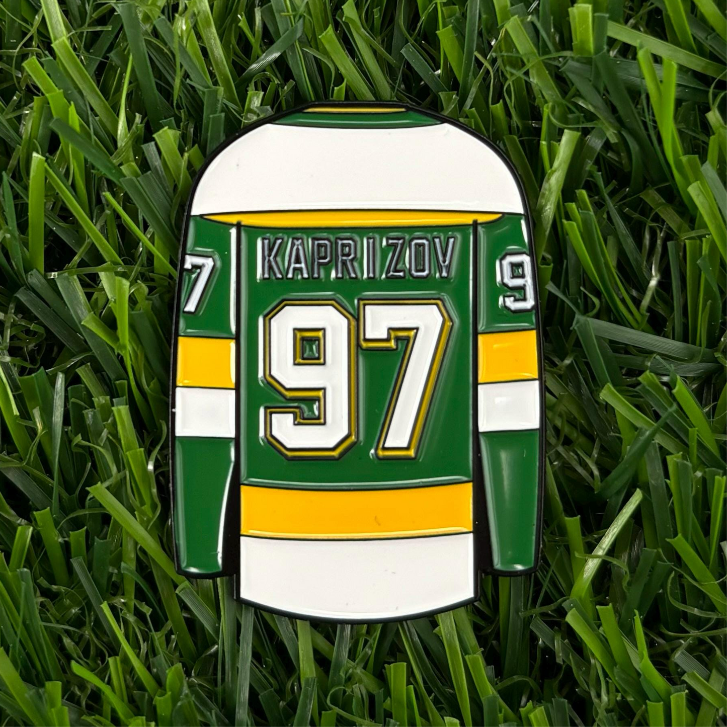 Kirill Kaprizov jersey-themed golf ball marker on grass - golf accessory for enthusiasts and collectors