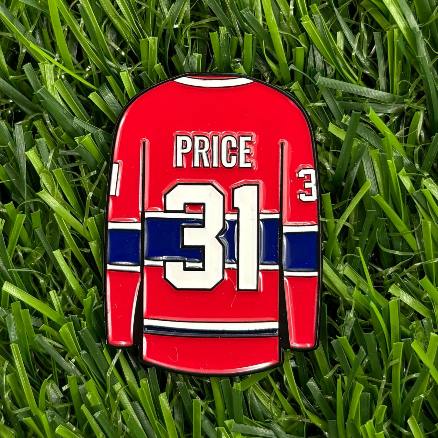 Carey Price hockey jersey-themed golf ball marker on grass - premium, durable, and stylish golf accessory for enthusiasts.